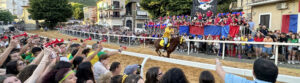 Un momento del palio - Facebook @Carosello storico dei rioni di Cori
